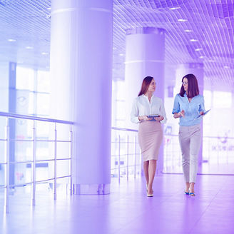 women walking in office