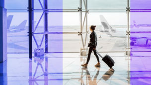 Women walking on airport with a bag thumbnail