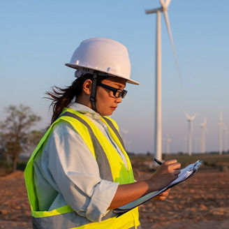 Women working at wind turbine farm banner