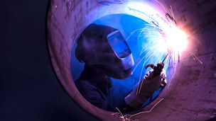 Worker performing welding operation