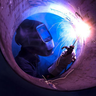 Worker performing welding operation
