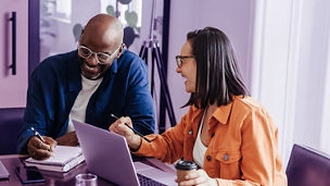 Co-workers in a modern office engaged in brainstorming and laughing together, portraying a casual and collaborative work environment.; Shutterstock ID 2488933677; purchase_order: advisory assurance marketing team; job: anne rouschop; client: ai campagne