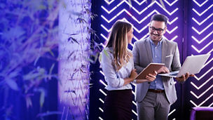 Woman and man laughing to each other