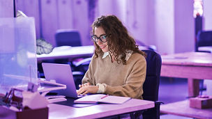 Young female businesswoman working on her laptop