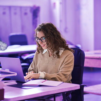 Young female businesswoman working on her laptop