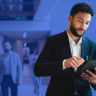 young man looking at a tablet