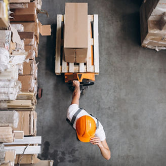 Young man working at a warehouse with boxes, Young man working at a warehouse with boxes