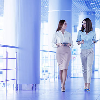 Two women in the office corridor